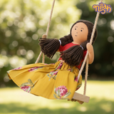 Nilah swinging in her backyard